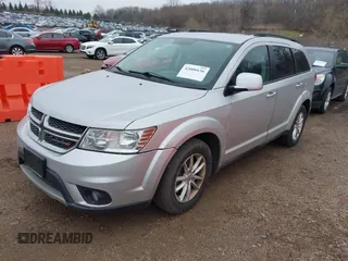 2013 Dodge Journey SXT with VIN 3C4PDCBG1DT647014, listed as a IAAI auction lot 42006636 with 192,911 mi miles. Bid and sale history available at carsss.com. Image 2.