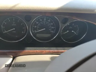 2004 Jaguar XJ with VIN SAJEA71C74SG02851, listed as a Copart auction lot 69056994 with 0 mi miles and Salvage Title. Bid and sale history available at carsss.com. Image 8.