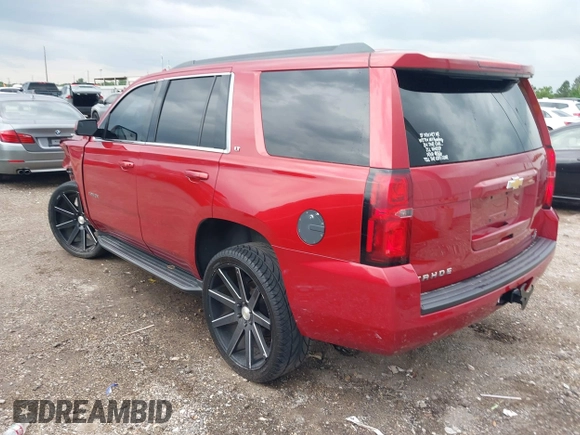 2015 Chevrolet Tahoe LT with VIN 1GNSCBKC1FR721605, listed as a IAAI auction lot 42184896 with 200,983 mi miles and . Bid and sale history available at DreamBid. Image 3.