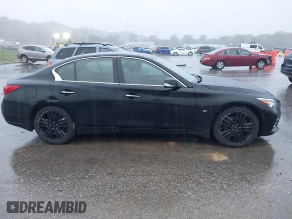 2015 Infiniti Q50 Premium z VIN JN1BV7ARXFM412382, wystawiony jako IAAI lot #40776813 z przebiegiem 66 406 mil mil oraz . Historia ofert i sprzedaży dostępna na DreamBid. Obrazek 13.