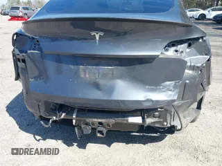 2021 Tesla Model Y Long Range with VIN 5YJYGDEE4MF119249, listed as a IAAI auction lot 41764711 with 87,796 mi miles. Bid and sale history available at carsss.com. Image 6.