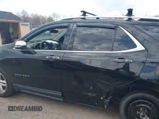2018 Chevrolet Equinox Premier with VIN 2GNAXWEX6J6302935, listed as a IAAI auction lot 42065883 with 61,983 mi miles and . Bid and sale history available at carsss.com. Image 14.