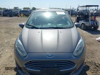 2014 Ford Fiesta SE z VIN 3FADP4BJ6EM117845, wystawiony jako IAAI lot #42431152 z przebiegiem 97 742 mil mil oraz . Historia ofert i sprzedaży dostępna na DreamBid. Obrazek 6.