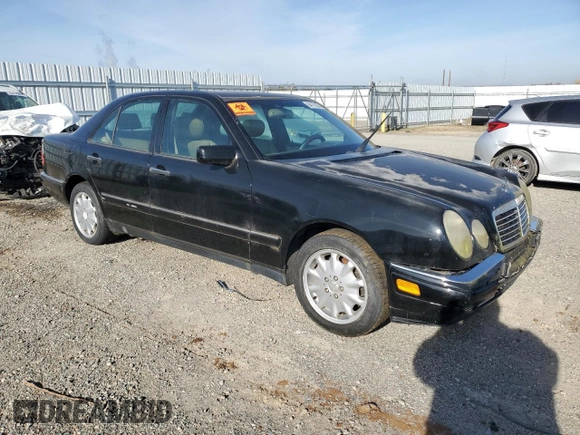 1997 Mercedes-Benz E-Class with VIN WDBJF55F5VJ028552, listed as a Copart auction lot 84172054 with 308,426 mi miles and Clean Title. Bid and sale history available at carsss.com. Image 4.