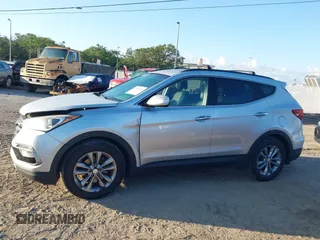 2018 Hyundai Santa Fe 2.0T z VIN 5XYZU4LA1JG516466, wystawiony jako IAAI lot #42265607 z przebiegiem 110 655 mil mil oraz . Historia ofert i sprzedaży dostępna na DreamBid. Obrazek 14.