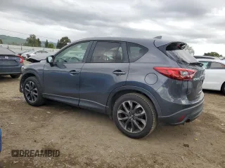 2016 Mazda CX-5 Grand Touring with VIN JM3KE2DY4G0795271, listed as a Copart auction lot 50986845 with 92,323 mi miles and Salvage Title. Bid and sale history available at carsss.com. Image 2.