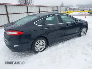 2016 Ford Fusion Energi SE Luxury with VIN 3FA6P0PU3GR166009, listed as a IAAI auction lot 41626623 with 133,596 mi miles. Bid and sale history available at carsss.com. Image 4.
