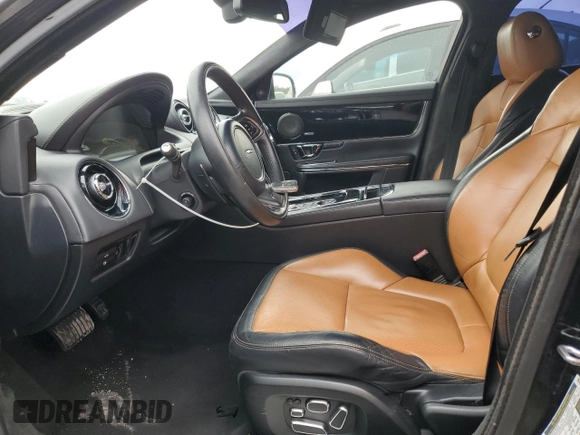 2014 Jaguar XJ with VIN SAJWA2EKXEMV64494, listed as a Copart auction lot 82634004 with 119,811 mi miles and Clean title. Bid and sale history available at DreamBid. Image 7.