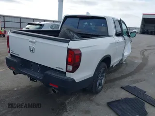 2023 Honda Ridgeline RTL with VIN 5FPYK3F55PB018188, listed as a IAAI auction lot 41952319 with 73,019 mi miles and . Bid and sale history available at DreamBid. Image 4.