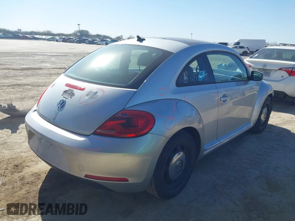 2013 Volkswagen Beetle 2.5L w/Sun/Sound/Nav with VIN 3VWJX7AT3DM663774, listed as a IAAI auction lot 41738146 with 98,064 mi miles and . Bid and sale history available at DreamBid. Image 4.