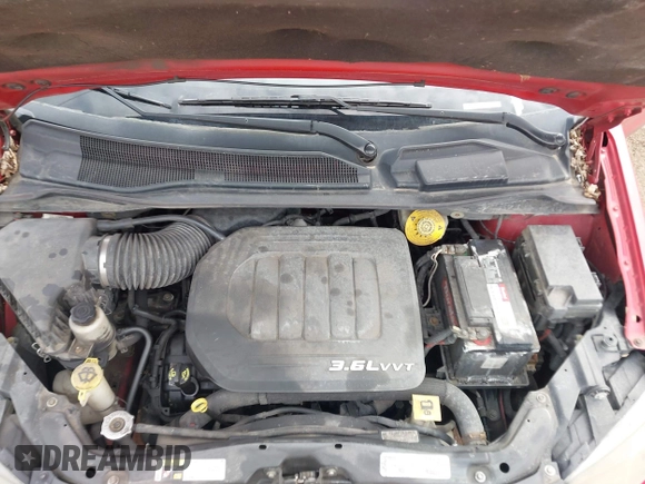 2014 Dodge Grand Caravan SXT with VIN 2C4RDGCG1ER371386, listed as a IAAI auction lot 41822952 with 228,052 mi miles and . Bid and sale history available at DreamBid. Image 10.