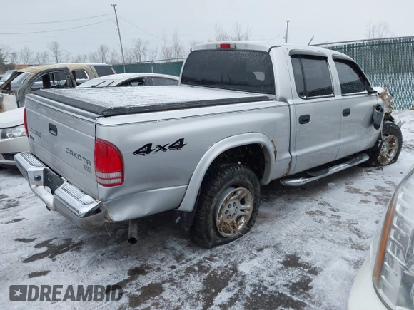 2004 Dodge Dakota SLT with VIN 1D7HG48N34S665027, listed as a IAAI auction lot 41395509 with 128,064 mi miles. Bid and sale history available at carsss.com. Image 4.