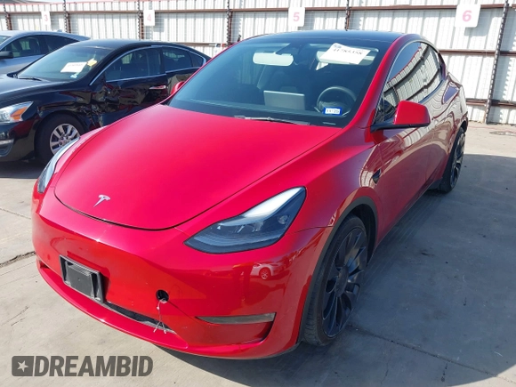 2022 Tesla Model Y Performance z VIN 7SAYGDEF0NF518740, wystawiony jako IAAI lot #41785358 z przebiegiem 50 692 mil mil oraz . Historia ofert i sprzedaży dostępna na DreamBid. Obrazek 22.