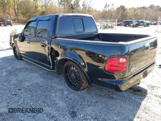 2002 Ford F-150 Harley Davidson with VIN 1FTRW07312KC24102, listed as a IAAI auction lot 41591917 with 1 mi miles. Bid and sale history available at carsss.com. Image 3.
