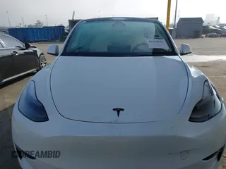 2023 Tesla Model Y Long Range with VIN 7SAYGAEE7PF766735, listed as a IAAI auction lot 41626651 with 21,983 mi miles. Bid and sale history available at carsss.com. Image 13.