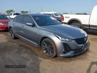 2022 Cadillac CT5 Sport z VIN 1G6DP5RKXN0115097, wystawiony jako IAAI lot #42083056 z przebiegiem Nie podano mil oraz . Historia ofert i sprzedaży dostępna na DreamBid. Obrazek 1.