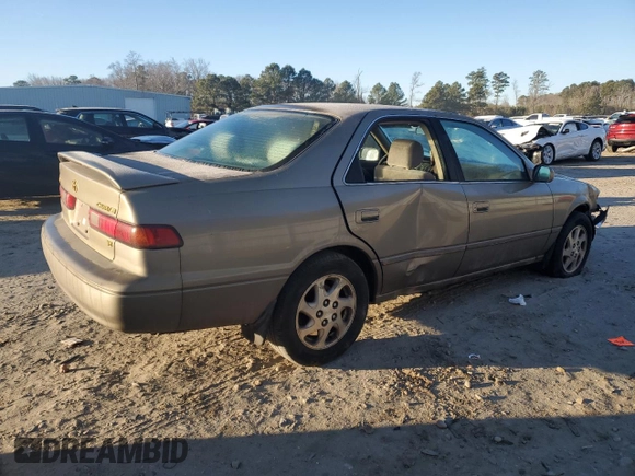 1999 Toyota Camry LE z VIN JT2BF22K0X0167589, wystawiony jako Copart lot #42699015 z przebiegiem 198 634 mil mil oraz Czysty tytuł • Clean title. Historia ofert i sprzedaży dostępna na DreamBid. Obrazek 3.