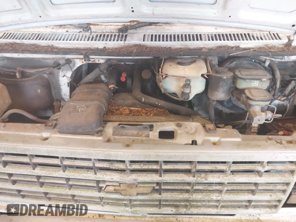 1992 Chevrolet Chevy Van z VIN 2GCEG25Z3N4144138, wystawiony jako IAAI lot #42389578 z przebiegiem 129 513 mil mil oraz . Historia ofert i sprzedaży dostępna na DreamBid. Obrazek 10.
