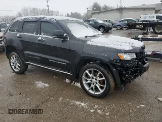 2015 Jeep Grand Cherokee Summit with VIN 1C4RJFJG2FC150752, listed as a Copart auction lot 45031365 with 151,682 mi miles and Salvage Title. Bid and sale history available at DreamBid. Image 4.