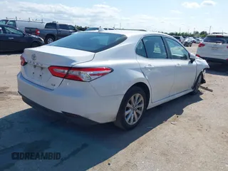 2019 Toyota Camry LE with VIN 4T1B11HK4KU180995, listed as a IAAI auction lot 42088737 with 133,813 mi miles and . Bid and sale history available at DreamBid. Image 4.