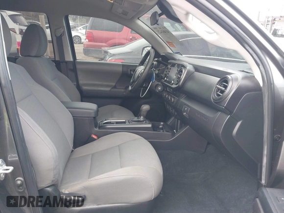 2023 Toyota Tacoma SR with VIN 3TYCZ5AN5PT138770, listed as a IAAI auction lot 41461423 with 19,785 mi miles and . Bid and sale history available at DreamBid. Image 5.