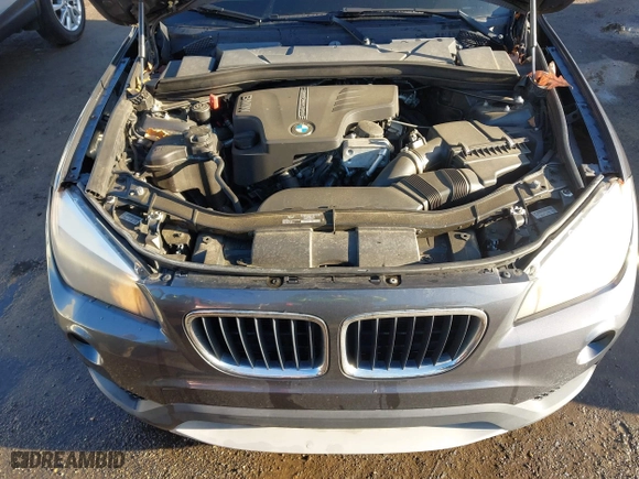 2014 BMW X1 sDrive28i with VIN WBAVM1C52EVW55890, listed as a IAAI auction lot 41512784 with 97,718 mi miles. Bid and sale history available at carsss.com. Image 10.