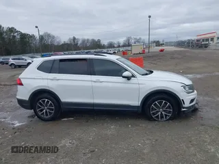 2020 Volkswagen Tiguan SE with VIN 3VV3B7AX2LM055418, listed as a IAAI auction lot 41248422 with Not Provided miles and . Bid and sale history available at DreamBid. Image 12.
