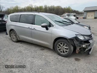 2021 Chrysler Voyager LXi with VIN 2C4RC1DG0MR521145, listed as a Copart auction lot 48062405 with 144,197 mi miles and Salvage Title. Bid and sale history available at DreamBid. Image 4.