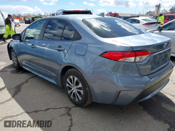 2021 Toyota Corolla Hybrid LE with VIN JTDEAMDE0MJ026601, listed as a IAAI auction lot 41797452 with 85,294 mi miles. Bid and sale history available at carsss.com. Image 3.