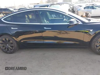 2018 Tesla Model 3 Long Range Battery with VIN 5YJ3E1EA0JF056979, listed as a IAAI auction lot 41865849 with 97,319 mi miles. Bid and sale history available at carsss.com. Image 13.