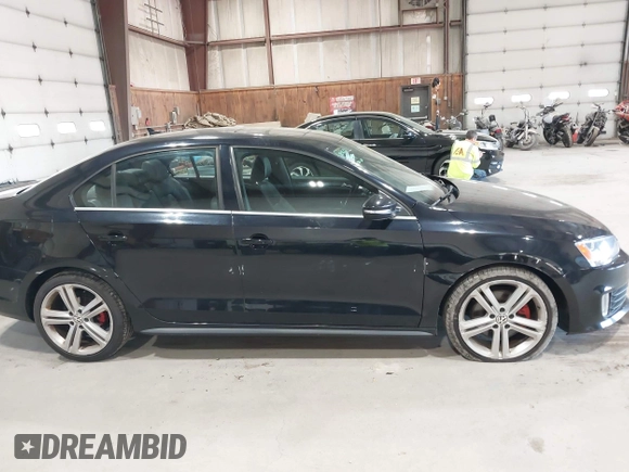 2015 Volkswagen Jetta Sedan 2.0T GLI SE with VIN 3VW5T7AJ0FM275867, listed as a IAAI auction lot 42133491 with 98,718 mi miles. Bid and sale history available at carsss.com. Image 12.