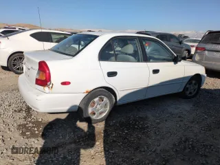 2000 Hyundai Accent z VIN KMHCG45G0YU084004, wystawiony jako Copart lot #42980585 z przebiegiem 167 545 mil mil oraz Czysty tytuł • Clean title. Historia ofert i sprzedaży dostępna na DreamBid. Obrazek 3.