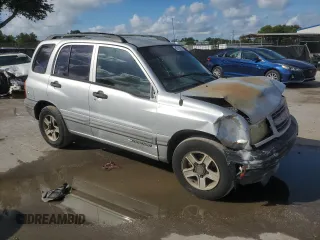 2003 Chevrolet Tracker with VIN 2CNBE13C836953178, listed as a Copart auction lot 60715605 with 128,978 mi miles and Salvage title. Bid and sale history available at DreamBid. Image 4.