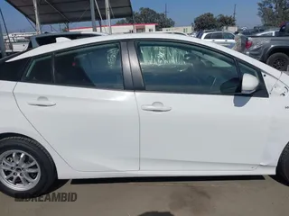 2022 Toyota Prius L Eco z VIN JTDKAMFU6N3177732, wystawiony jako IAAI lot #42504790 z przebiegiem 65 338 mil mil oraz . Historia ofert i sprzedaży dostępna na DreamBid. Obrazek 13.
