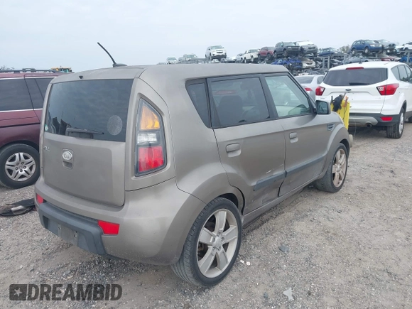 2010 Kia Soul + with VIN KNDJT2A22A7045182, listed as a IAAI auction lot 41322297 with 178,817 mi miles. Bid and sale history available at carsss.com. Image 4.