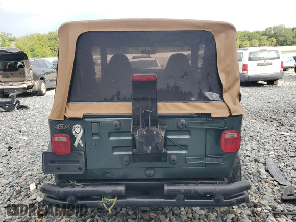 2002 Jeep Wrangler Sahara with VIN 1J4FA59S52P763290, listed as a Copart auction lot 59115665 with 129,479 mi miles and Non repairable. Bid and sale history available at DreamBid. Image 6.