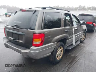 2000 Jeep Grand Cherokee Laredo with VIN 1J4GW48S1YC170303, listed as a IAAI auction lot 41582257 with 191,062 mi miles and . Bid and sale history available at DreamBid. Image 4.