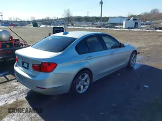 2013 BMW 3 Series 328i xDrive with VIN WBA3B5G51DNS05659, listed as a IAAI auction lot 41377886 with 159,972 mi miles. Bid and sale history available at carsss.com. Image 4.