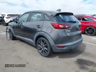 2018 Mazda CX-3 Touring z VIN JM1DKFC7XJ0312349, wystawiony jako IAAI lot #42368311 z przebiegiem 97 772 mil mil oraz . Historia ofert i sprzedaży dostępna na DreamBid. Obrazek 3.