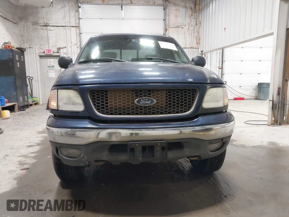 2003 Ford F-150 XLT z VIN 1FTRW08L73KC11631, wystawiony jako IAAI lot #42673130 z przebiegiem 188 945 mil mil oraz . Historia ofert i sprzedaży dostępna na DreamBid. Obrazek 12.