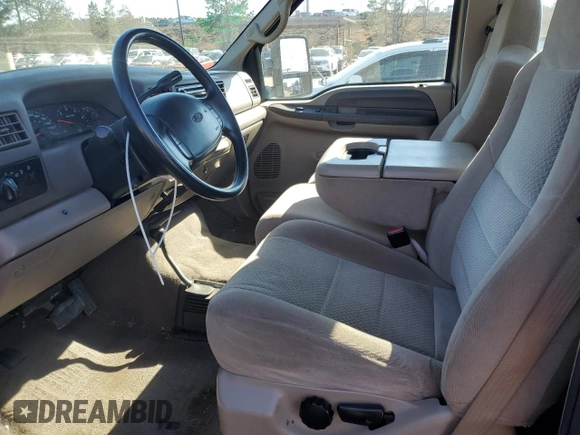 2002 Ford F-250 XL with VIN 1FTNF21L02EA83007, listed as a Copart auction lot 87880345 with 104,889 mi miles and Salvage title. Bid and sale history available at DreamBid. Image 7.