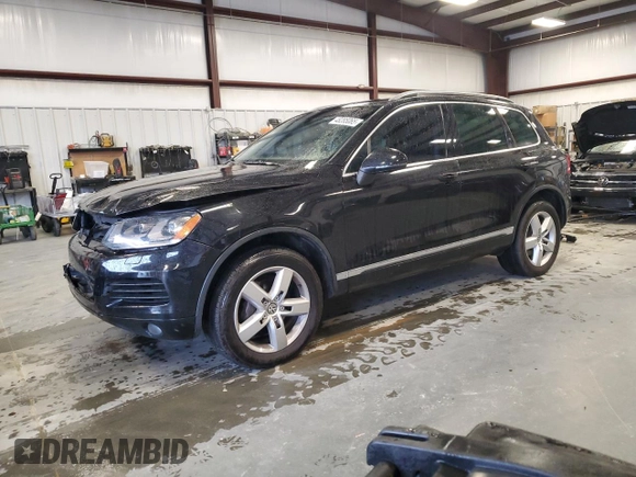 2011 Volkswagen Touareg Exec with VIN WVGFK9BP8BD003948, listed as a Copart auction lot 48285065 with 152,497 mi miles and Salvage Title. Bid and sale history available at DreamBid. Image 1.