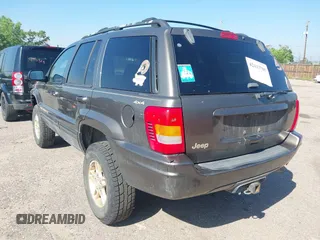 1999 Jeep Grand Cherokee Limited with VIN 1J4GW68N7XC617687, listed as a IAAI auction lot 42433705 with 186,312 mi miles and . Bid and sale history available at DreamBid. Image 3.