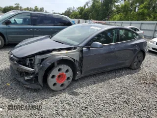 2023 Tesla Model 3 z VIN 5YJ3E1EA1PF692481, wystawiony jako Copart lot #61764165 z przebiegiem 22 649 mil mil oraz Szkoda całkowita • Salvage title. Historia ofert i sprzedaży dostępna na DreamBid. Obrazek 1.