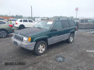 1996 Jeep Grand Cherokee Laredo with VIN 1J4GZ58S6TC333856, listed as a IAAI auction lot 42504895 with 176,955 mi miles and . Bid and sale history available at DreamBid. Image 2.
