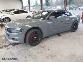 2019 Dodge Charger SXT with VIN 2C3CDXJG2KH547683, listed as a IAAI auction lot 41232974 with 75,960 mi miles. Bid and sale history available at carsss.com. Image 2.