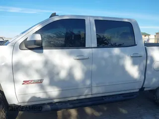 2017 Chevrolet Silverado 1500 LT with VIN 3GCUKREC4HG466329, listed as a IAAI auction lot 41305052 with 57,844 mi miles and . Bid and sale history available at DreamBid. Image 13.