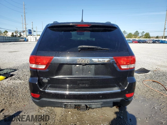 2013 Jeep Grand Cherokee Overland with VIN 1C4RJFCG2DC653207, listed as a Copart auction lot 48680885 with 276,020 mi miles and Salvage Title. Bid and sale history available at carsss.com. Image 6.
