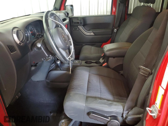 2012 Jeep Wrangler Unlimited Sport z VIN 1C4BJWDG2CL171531, wystawiony jako Copart lot #62181805 z przebiegiem 195 394 mil mil oraz Szkoda całkowita • Salvage title. Historia ofert i sprzedaży dostępna na DreamBid. Obrazek 7.