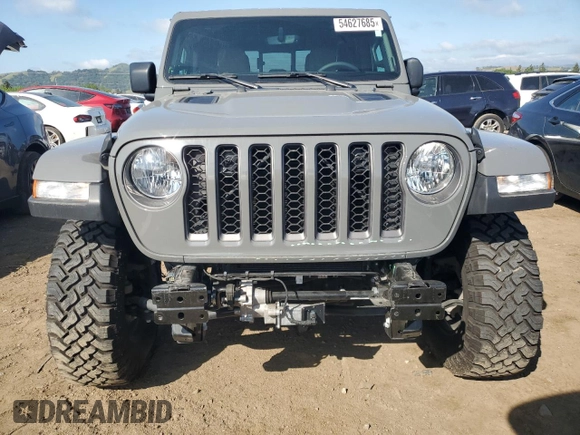 2023 Jeep Gladiator Rubicon with VIN 1C6JJTBG8PL550219, listed as a Copart auction lot 54627685 with 9,671 mi miles and Salvage title. Bid and sale history available at DreamBid. Image 5.